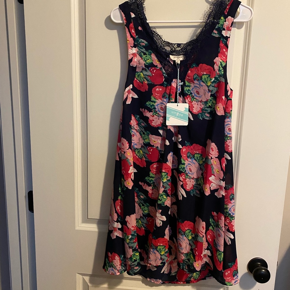 BRAND NEW with tags floral tunic dress. Size small.